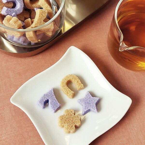 Original red and purple sugars in the shape of a star, clover, horseshoe and the number 7.
